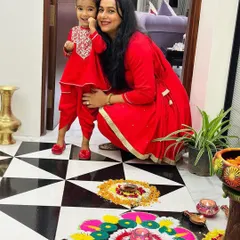 Makeup artist Jyotsna Singh and her daughter look radiant in our coordinated tomato red outfits for Diwali. The matching peplum kurta and tulip pants sets are a modern take on traditional festive wear, perfect for creating beautiful memories.