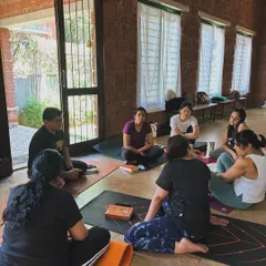Our workshops are not just about practice, but also about community and discussion. Here, students gather after a pranayama session to share insights and deepen their understanding together.