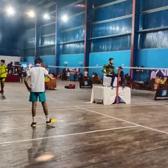 Two young players prepare for their match during a tournament. I ensure that every event, big or small, has the organized feel of a professional competition, right down to the on-court setup.