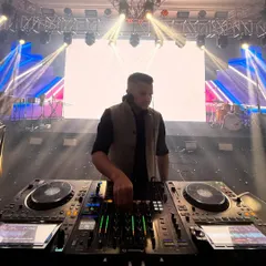 On stage in Singapore for a grand wedding reception. The setup featured a massive LED screen and a full lighting rig, which I use to create an immersive experience for everyone on the dance floor.