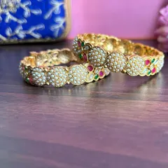 Another view of the pearl bangles, showing the fine detailing on the side.