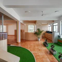A look at our indoor sensory path and kitchen area. The space is designed to flow, allowing children to move freely between different types of activities.