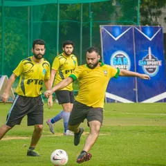 A player in a Brazil jersey lines up a shot. My corporate tournaments bring out the passion of players from all backgrounds.