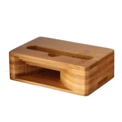 A side view of our bamboo mobile stand and passive sound amplifier. This image showcases the simple yet clever design that holds your phone securely while naturally boosting its volume, all made from a single piece of sustainable bamboo.