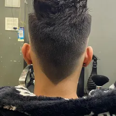 The back view of a perfect V-shaped taper fade. The symmetry and sharpness of the V is a detail I take great pride in.