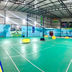 A wide view of our professional indoor badminton courts. We provide a well-lit, spacious, and fully equipped environment for players to train and excel.