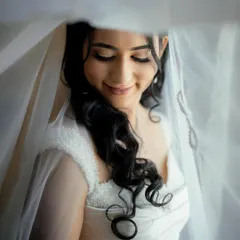 This ethereal look for my Christian bride is all about soft, romantic beauty. I used a light touch to create luminous skin and gentle definition on the eyes, perfectly complementing her delicate veil and white gown for a truly angelic appearance.