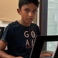 A young student focuses on his keyboard lesson. We create a supportive atmosphere for beginners to feel comfortable and confident.