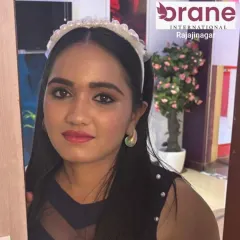 A full-face view of the completed 'Glowy Dewy' makeup look. This highlights the balanced application, from the defined eyes and pink lip to the smooth, luminous skin finish, achieved by our talented students.