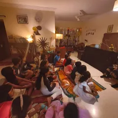 A glimpse into a lively 6th birthday party. The room is filled with children enjoying a puppet show, a core part of my entertainment offering for kids' events.
