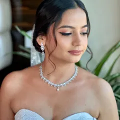 A close-up of Beracah's makeup. We used soft pink and neutral tones on her eyes and cheeks to create a fresh, youthful, and romantic look for her church wedding.