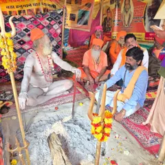 My spiritual journey involves learning from revered saints and participating in sacred rituals like homams. This image shows me receiving blessings and knowledge at a traditional fire ceremony.