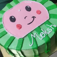 Perfect for a child's birthday, this Cocomelon theme cake brings the beloved character to life. The design is piped with bright green and pink buttercream for a fun and recognizable look.