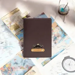 This personalized passport cover, shown against a backdrop of maps, is made for adventure. The mustache charm adds a fun, personal touch to this essential travel document holder.