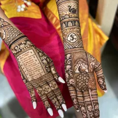 Your wedding vows, beautifully written in henna. This is a wonderfully personal way to carry your promises with you, surrounded by intricate peacock and floral details.