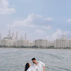 A beautiful moment on a private yacht, with the magnificent Dubai Marina skyline creating a picture-perfect backdrop for this destination pre-wedding shoot.