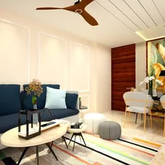 A look at a cozy living and dining area we designed for a 2BHK home. We used a deep blue sofa to add a pop of color against the neutral walls and a simple, elegant dining set that doesn't overwhelm the space.