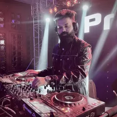 A close-up shot of me at the Pioneer DJ console, my command center for the night. I use top-of-the-line, professional equipment to guarantee flawless sound quality and technical execution for every event.