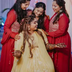 The bride showing off her beautiful mehndi, surrounded by her loving bridesmaids. These are the cherished moments with the bride tribe.