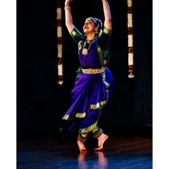 Another dynamic pose from Chaitra Rao's recital. Notice the energy in her posture and the clarity of her lines, a result of dedicated practice in the traditional Bharatanatyam style.