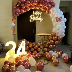This is a duplicate of ID 57, 76, 81, 120, 210. An elegant and modern ring backdrop is perfect for home celebrations. The setup features a circular frame with a rose gold and white chrome balloon arrangement, a 'Happy Birthday' neon sign, and a light-up marquee number '24'.