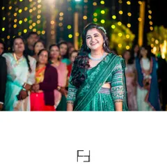 The bride's radiant smile as she watches the evening's performances. Capturing these moments of joy and appreciation is a key part of documenting the reception.