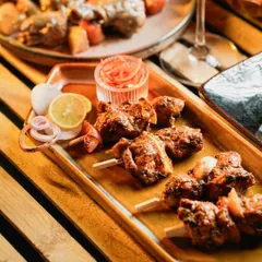 These Murg Adani Boti skewers are juicy, smoky, and incredibly satisfying. Each piece of chicken is marinated and grilled, perfect for a live appetizer station at any party.