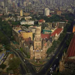 An aerial view of the iconic BMC building in Mumbai. My drone photography highlights the stunning neo-Gothic architecture and its unique placement within the bustling cityscape, a perfect example of Mumbai architectural videography.