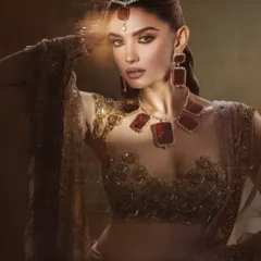 The play of light in this shot adds a magical quality to the makeup. This is a perfect example of a high concept beauty look.