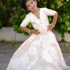 Another pose in the lovely off-white custom lehenga. I ensure that kids' outfits have a perfect finish and soft lining so they feel happy and comfortable wearing them.