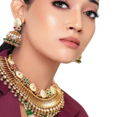 Draped in culture, tailored for power. This modern take on ethnic wear pairs a heavy traditional necklace with a sharp blazer, creating a unique fusion look.