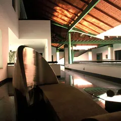 At the LMW Headquarters in Coimbatore, I used a series of courtyards to structure the low-rise building. This interior view shows how these open spaces create a traditional spatial sensibility, with a custom metal sculpture adding an artistic focus.