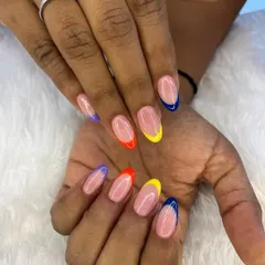 Why choose one color when you can have a rainbow? This playful design features a modern French manicure with a different bright color on each tip.