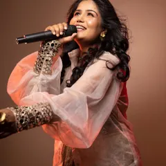 A dynamic shot of the singer, with makeup designed to catch the light and look great in motion.