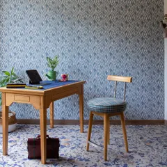 This study at Ridge View was once a guest bedroom. We reimagined it as a den and workspace, using deep blues, light oak furniture, and playful patterns. The work desk by the window is bathed in natural light, creating a perfect spot for deep focus.