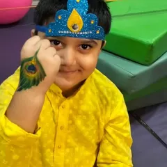 This little Krishna is showing off his peacock feather hand painting and handmade crown. We love incorporating art and craft into our festival celebrations.