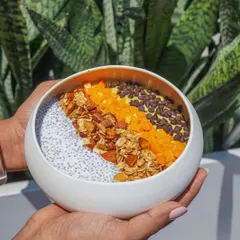 We use natural light and thoughtful composition to create bright and appealing lifestyle food shots. This image of a healthy smoothie bowl captures a feeling of wellness and morning energy.