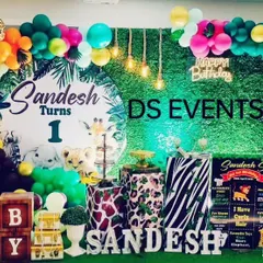 I bring the wild to the party with my popular Jungle Safari theme. This setup includes a lush greenery backdrop, a custom circular name board, animal print plinths for the cake, and a vibrant balloon arch with animal-themed accents.