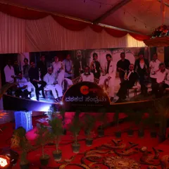 The main photo backdrop for the Zee Kannada event, featuring prominent branding and a collage of the channel's stars, set against a professionally lit stage.