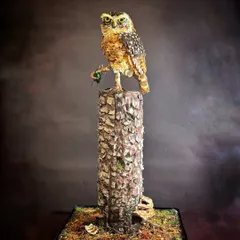 A full view of my silver-award-winning owl cake. The entire structure, including the owl and the textured wood stump, is a testament to my love for nature's details, all created from edible materials.