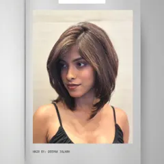 A closer look at a modern, layered haircut that adds volume and movement, creating a fresh and stylish look.