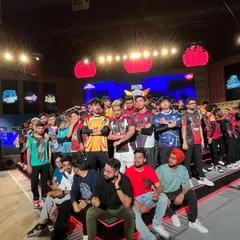 E-sports players and teams gather for a group photo on the custom-built stage. We are the chosen venue for the biggest names and teams in the Indian gaming community.