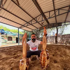 Our founder, Rishabh Malhotra, in his element at a traditional akhada. This image embodies our mission: to honor the roots of Indian strength training, connecting with the humility, discipline, and power of the soil.