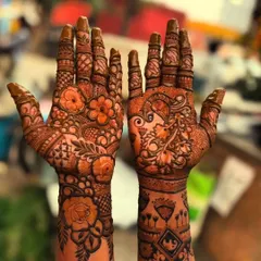 This portrait design, while intricate, covers only one side of the hand. It's a great option for someone who wants a statement piece without full coverage.