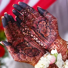 The stunning result of an engagement mehndi. The deep, dark stain on the fingers and palms looks absolutely beautiful.