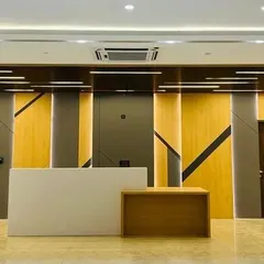 The reception area I designed for St. Xavier's High School makes a powerful first impression. The interplay of geometric wood panels and dynamic strip lighting creates a sense of modern sophistication and institutional pride.
