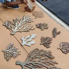 A duplicate shot showing the preparation of the coral forms for our art folly. This hands-on stage is crucial for ensuring the final piece has the depth and complexity we envisioned.