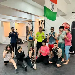 The strong and smiling faces after a tough boxing workshop. This is a community of women who push each other to be better, stronger, and more confident.