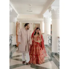 A candid moment of the bride laughing while walking with her groom. It's these unposed, genuine reactions that we strive to capture.