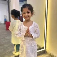 A student in a simple white kurta, ready for her Independence Day performance. We believe in celebrating every occasion with dance.